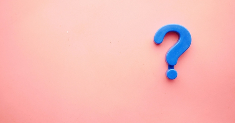 3D blue question mark on a pink background